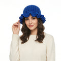 Crochet hat with ruffle in blue, featuring a stylish design and a comfortable fit