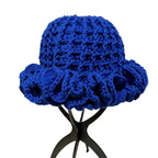 Blue crochet hat with ruffle design, perfect for stylish headwear in all seasons