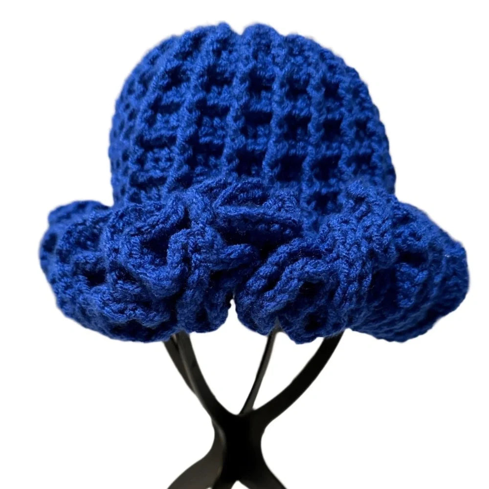 Vibrant blue crochet hat with ruffle detailing for a stylish and playful look