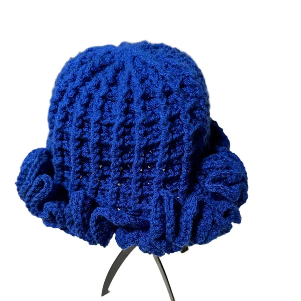 Bright blue crochet hat with ruffle detail, perfect for stylish warmth and comfort