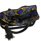 Interior view of a ThreadsByHannah crossbody women's handbag featuring floral design and braided straps