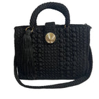 Black crochet crossbody women's handbag with a decorative tassel and stylish button closure