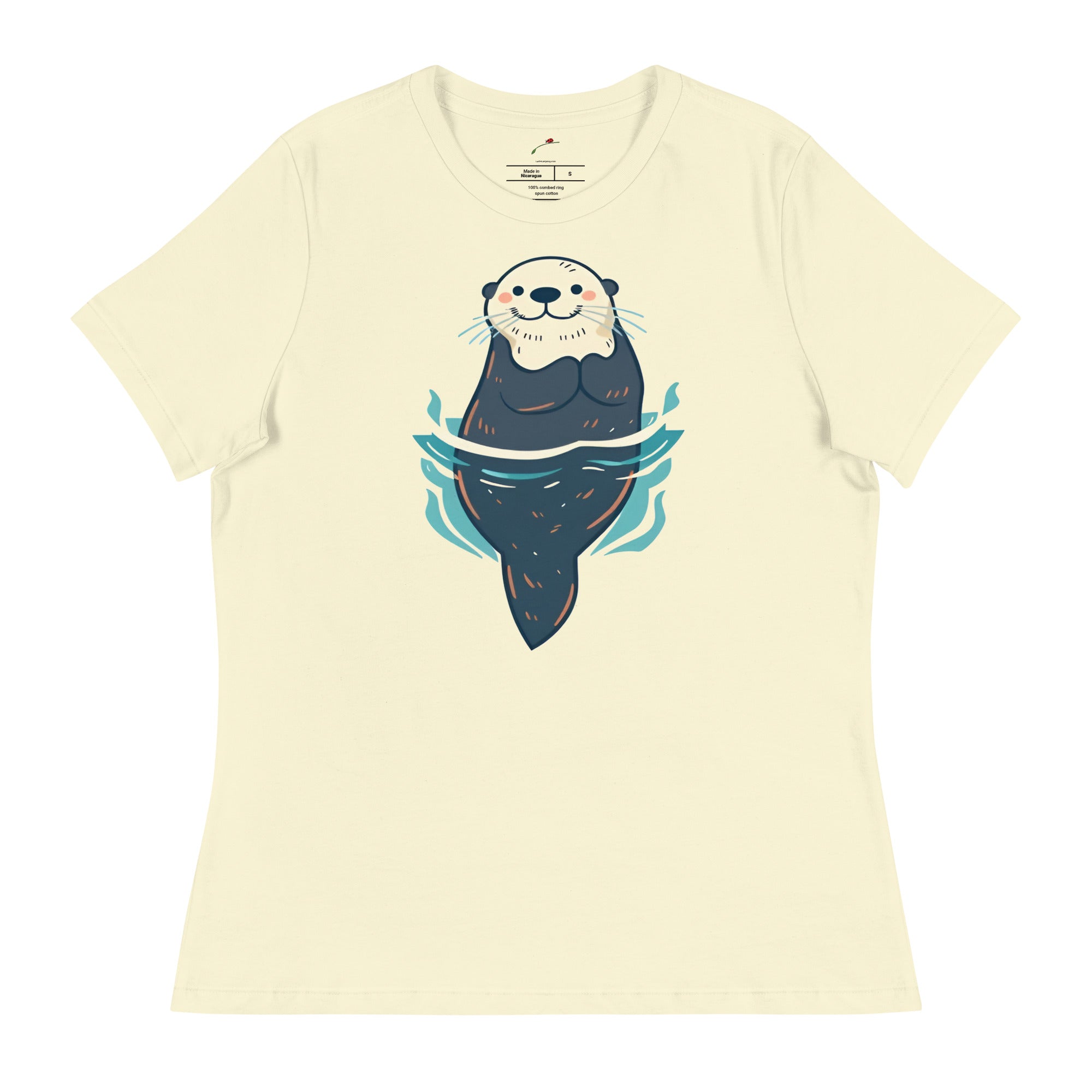 curious sea otter t-shirt with a cute otter floating and smiling in water design on cream fabric