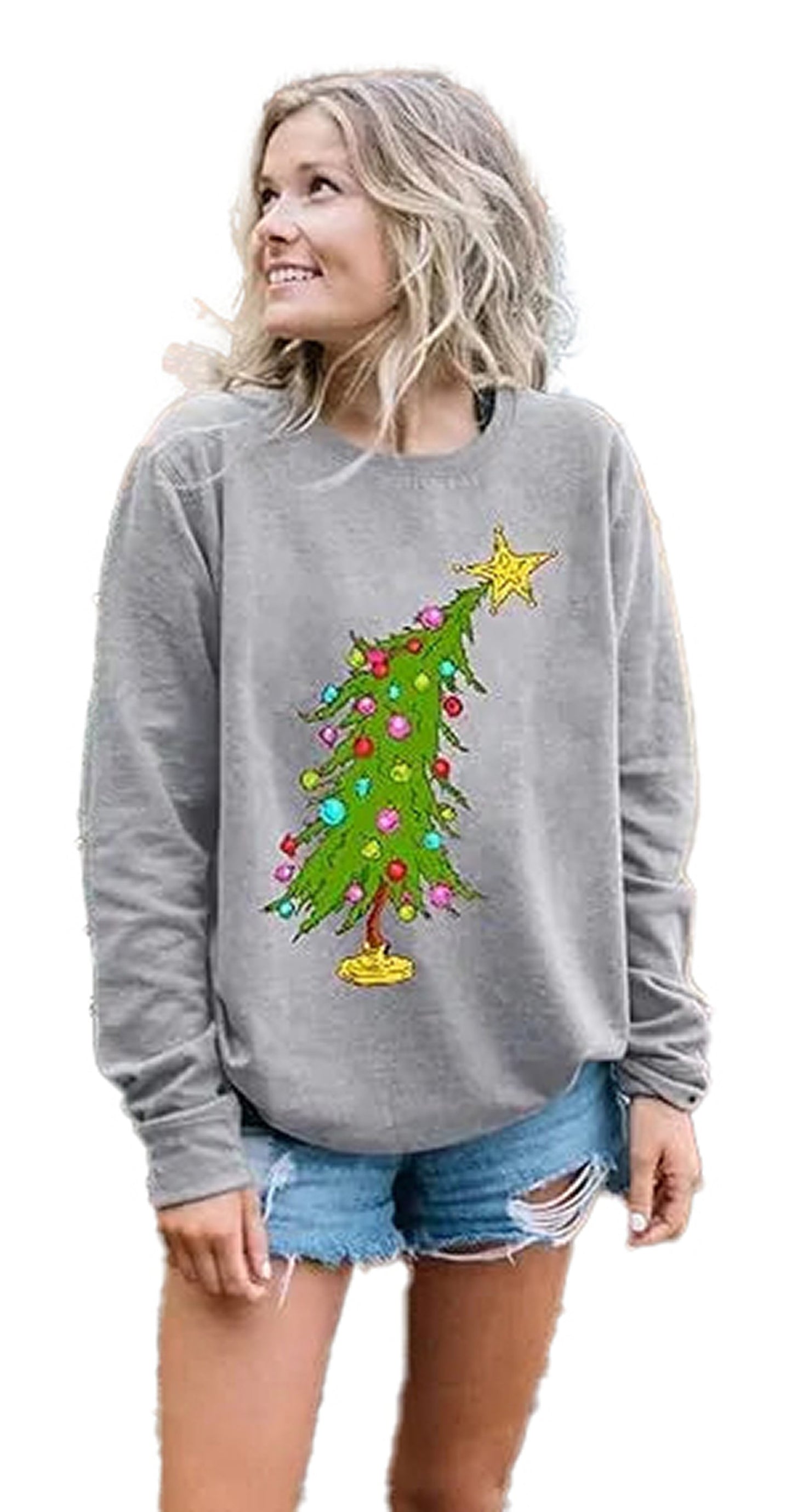 Woman wearing a grey sweatshirt with a colorful Christmas tree design, ideal for cute Christmas sweatshirts for women