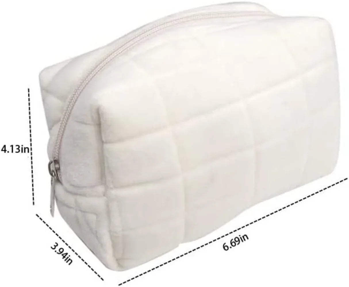 Cute plush makeup bag in soft white with quilted design and zipper closure for cosmetics storage