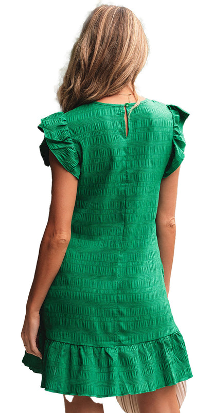 Back view of a dark green flutter sleeve mini dress with ruffle hem and textured fabric