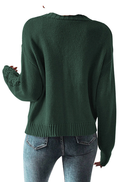 Dark khaki open knit cardigan with a relaxed fit and subtle textured detailing on the sleeves