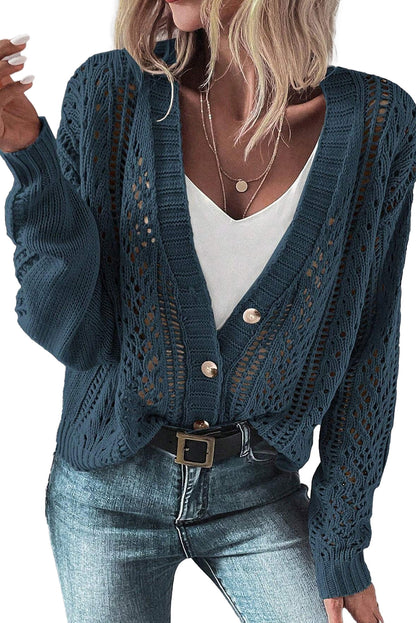 Stylish dark khaki open knit cardigan paired with a white top and blue jeans for a casual look