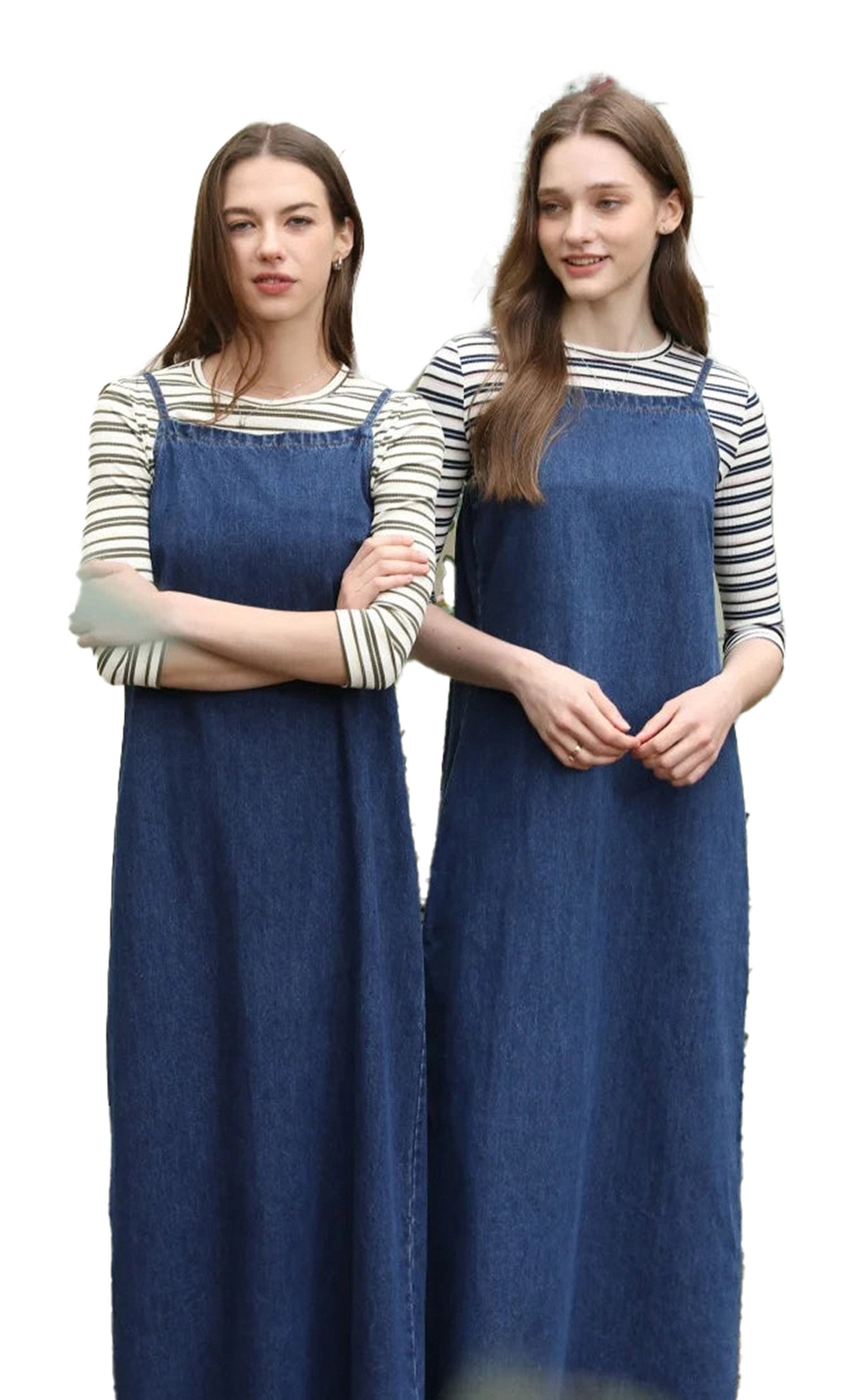 Two models wearing a denim jumper dress for women styled with striped tops