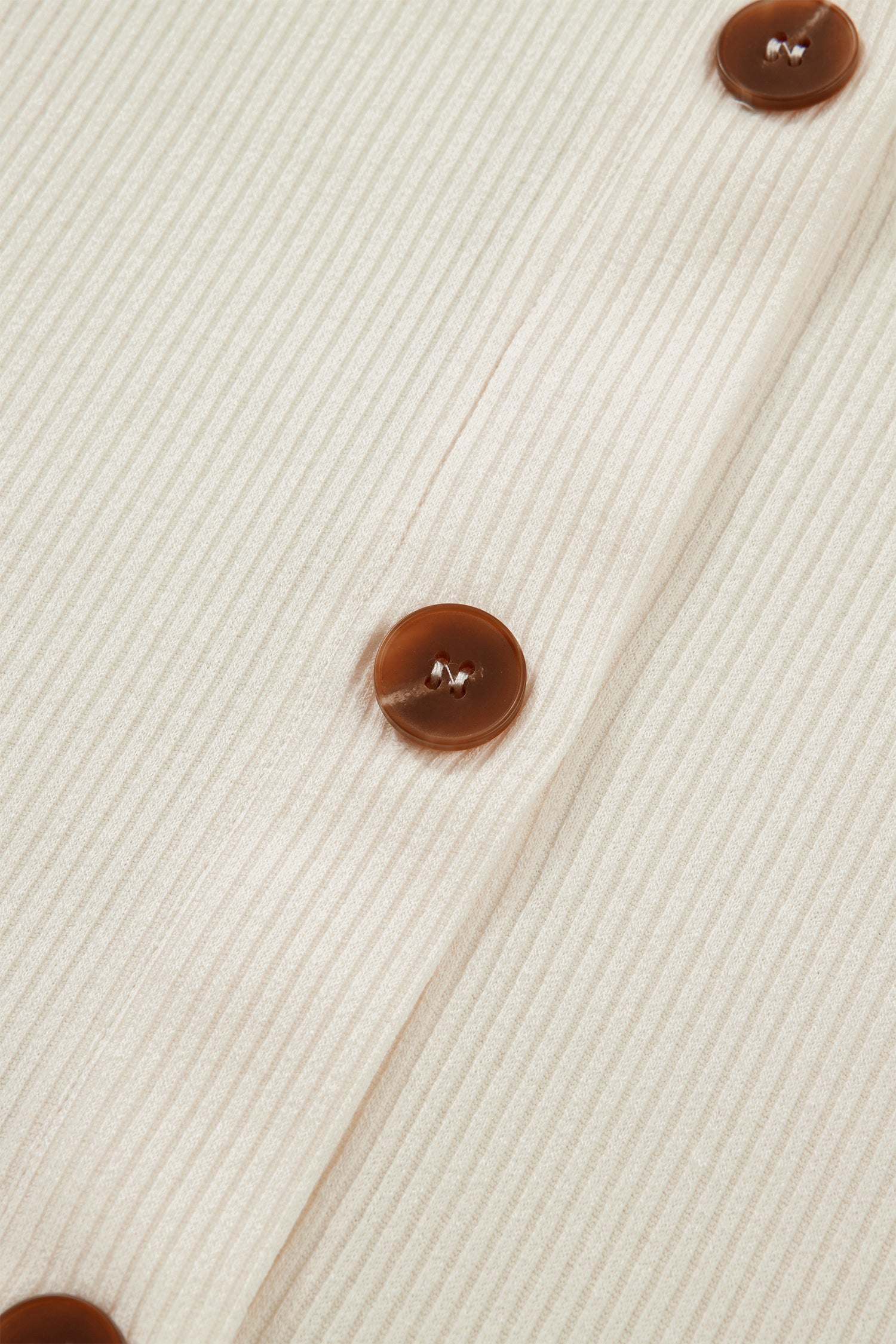 Light cream denim shirt with stylish brown buttons and ribbed texture for a trendy look