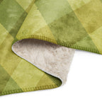 LuckeLadybug Sherpa blanket with green diamond pattern bedding and soft fluffy cream lining