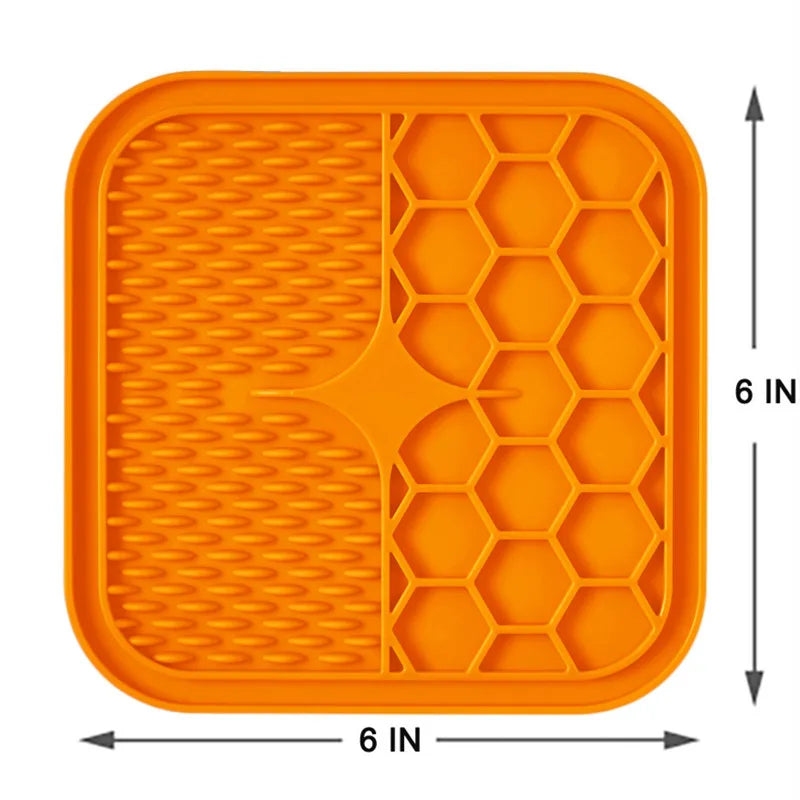 Orange dog enrichment toy pad with textured surfaces for stimulating playtime and feeding