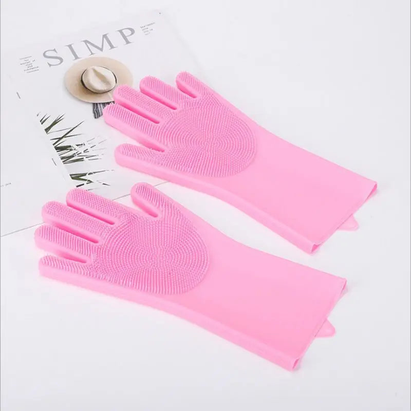 Pink silicone grooming gloves for dogs, perfect for pet grooming near me