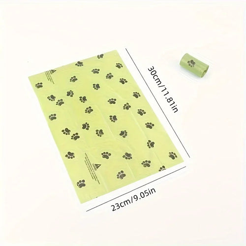 Eco-friendly poop bags for dog in green with paw print design, measuring 30cm by 23cm