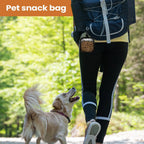 LuckeLadybug dog treat pouch attached to a hiker's waist for convenient pet snacking on outdoor adventures