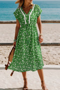 Green floral LuckeLadybug LLC fit and flare dress for vacation with v-neck and adjustable waist