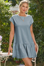 Casual blue dress from t-shirt style with short sleeves and a flared hem