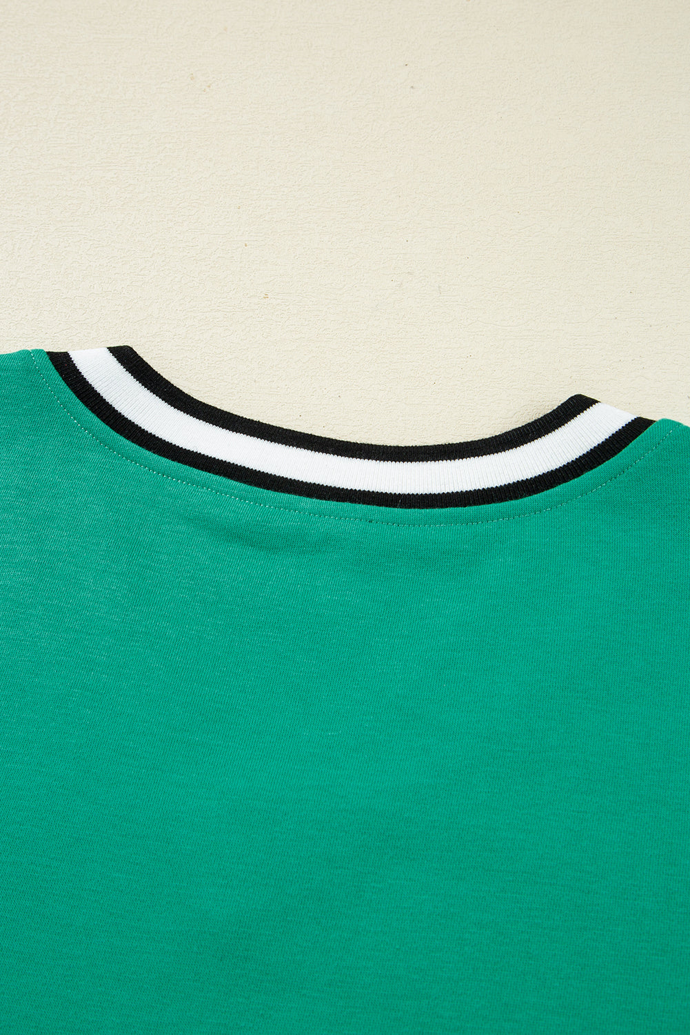 Green T-shirt with a stylish striped collar designed to dress from t-shirt for casual wear