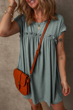 Light blue dress from t-shirt style with ruffled detailing and a stylish crossbody bag