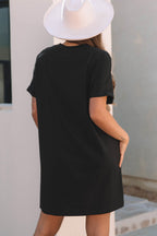 Back view of a black LuckeLadybug LLC mini dress for casual summer wear