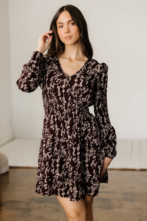 LuckeLadybug mini dress with a fit and flare design featuring a floral pattern and puff sleeves