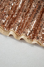 Shiny rose gold sequins on a mini dress by LuckeLadybug LLC with a ruffled hem design
