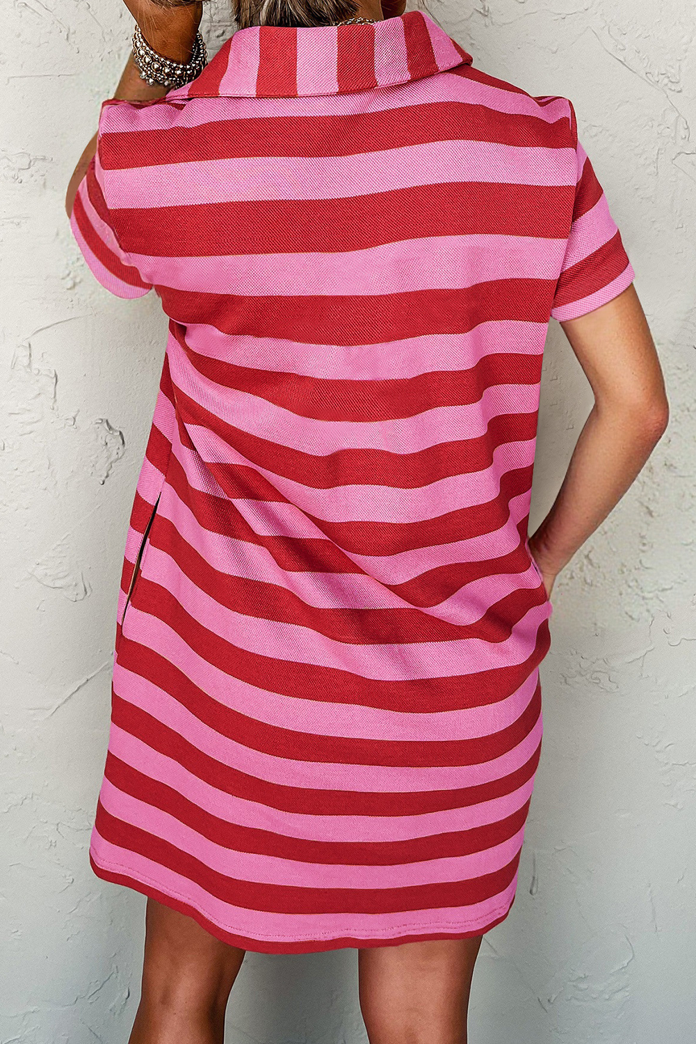 Back view of a pink and red striped T-Shirt dress shirt for men, featuring a stylish collar
