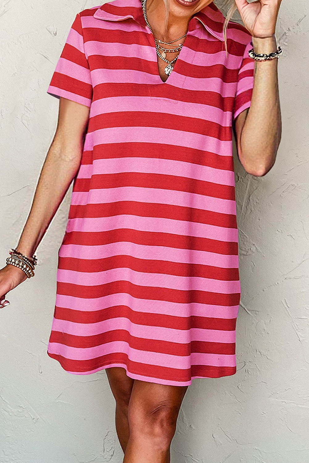 Pink striped dress shirt for men by LuckeLadybug LLC, featuring a collared neckline and short sleeves.