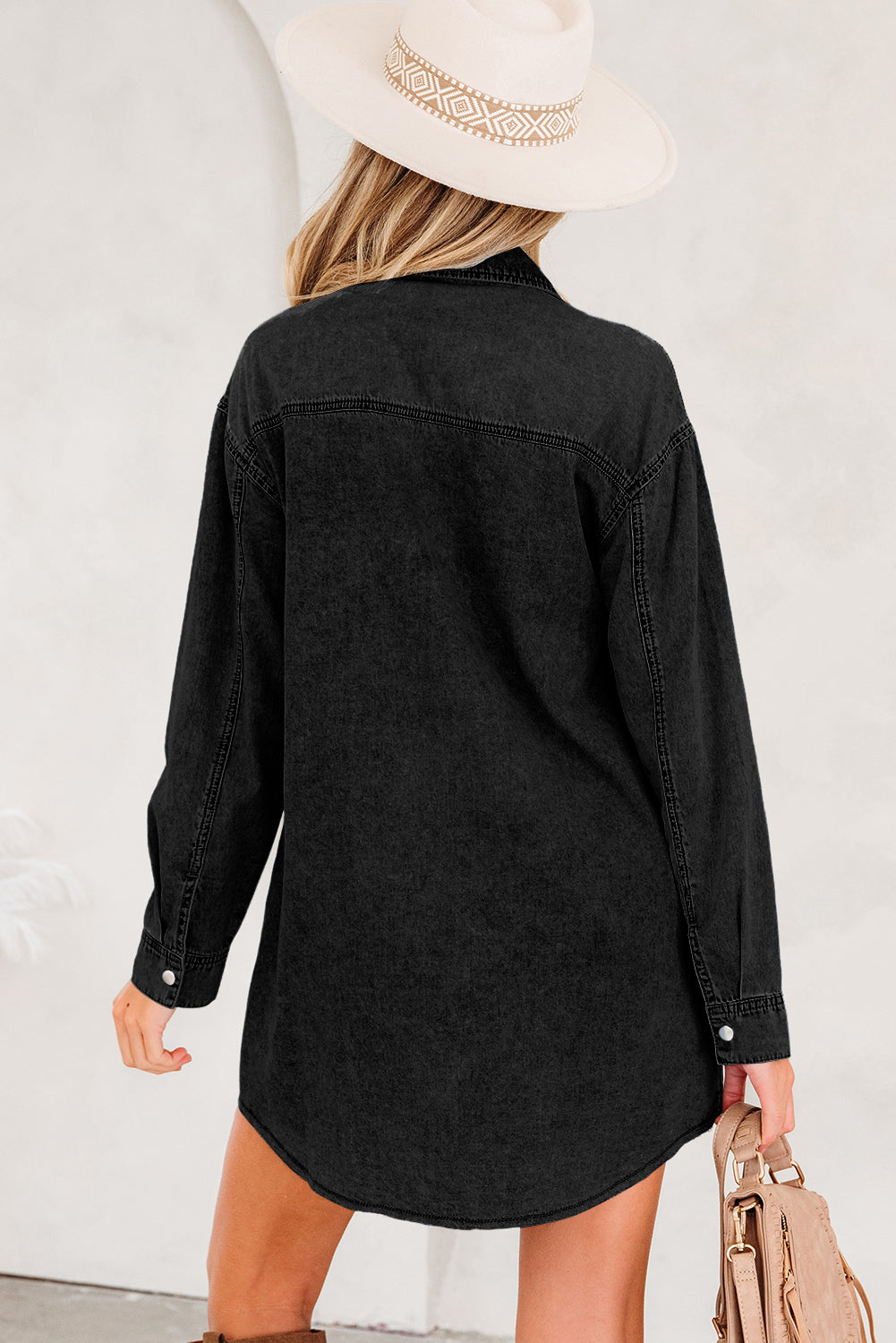 Black denim shirt dress with long sleeves perfect for casual outings or layering with denim