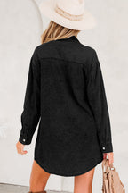 Black denim shirt dress with long sleeves perfect for casual outings or layering with denim