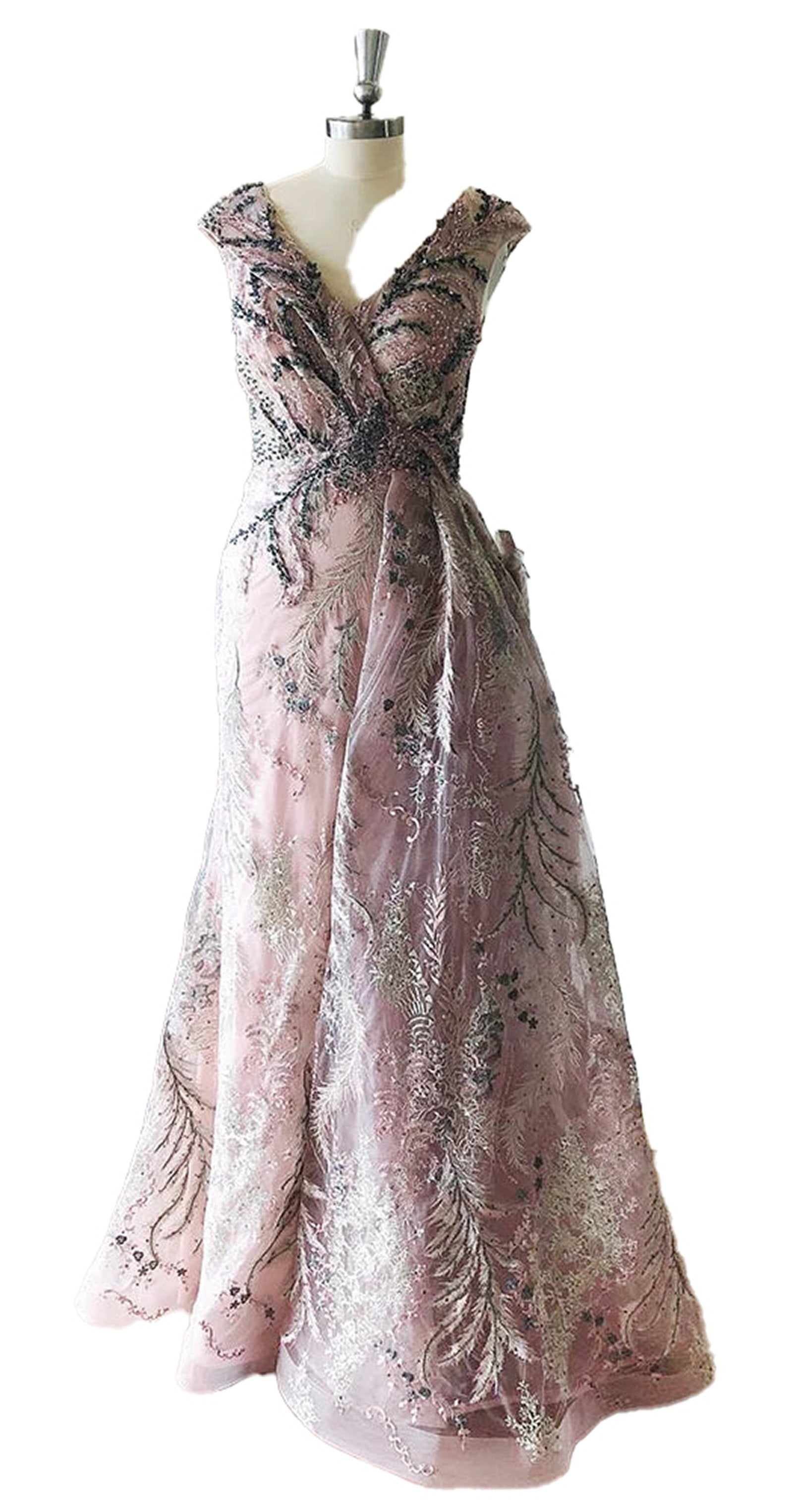 Elegant Dubai mermaid evening gown in soft pink with intricate beading and leaf patterns