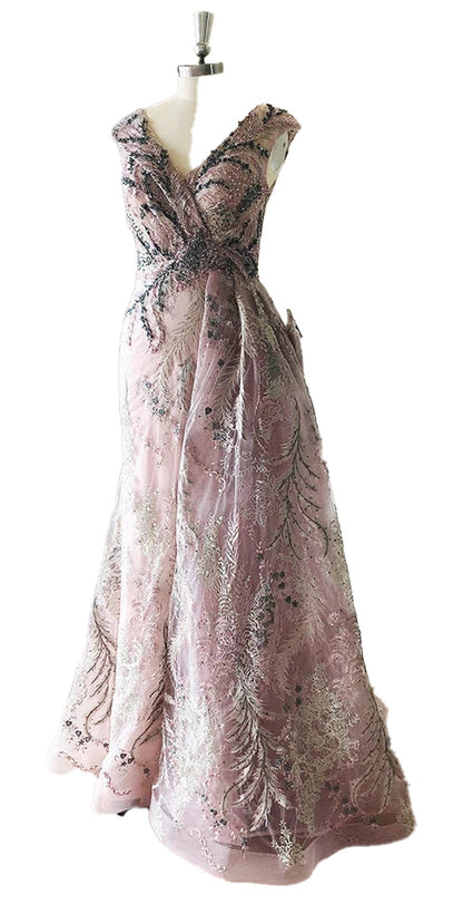 LuckeLadybug LLC Dubai mermaid evening gown in soft pink with elegant beadwork and flowing silhouette
