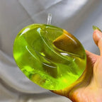 Green dumplings squishy toy in hand, perfect for stress relief and sensory fun