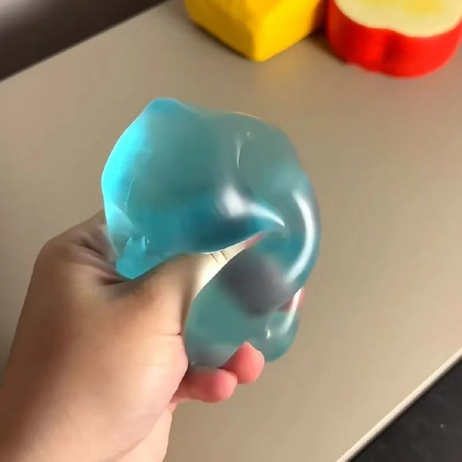 Translucent blue dumplings squishy in hand, perfect for stress relief and tactile fun