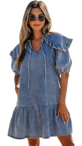 LuckeLadybug dusk blue ruffled denim mini dress with puff sleeves and a tiered skirt on the beach