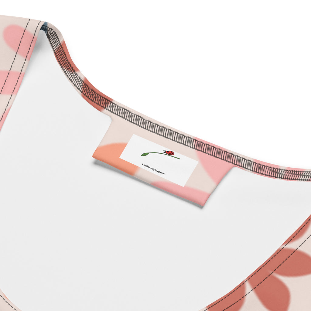 Close-up of LuckeLadybug elegant floral print dress neckline and label inside the bodycon dress