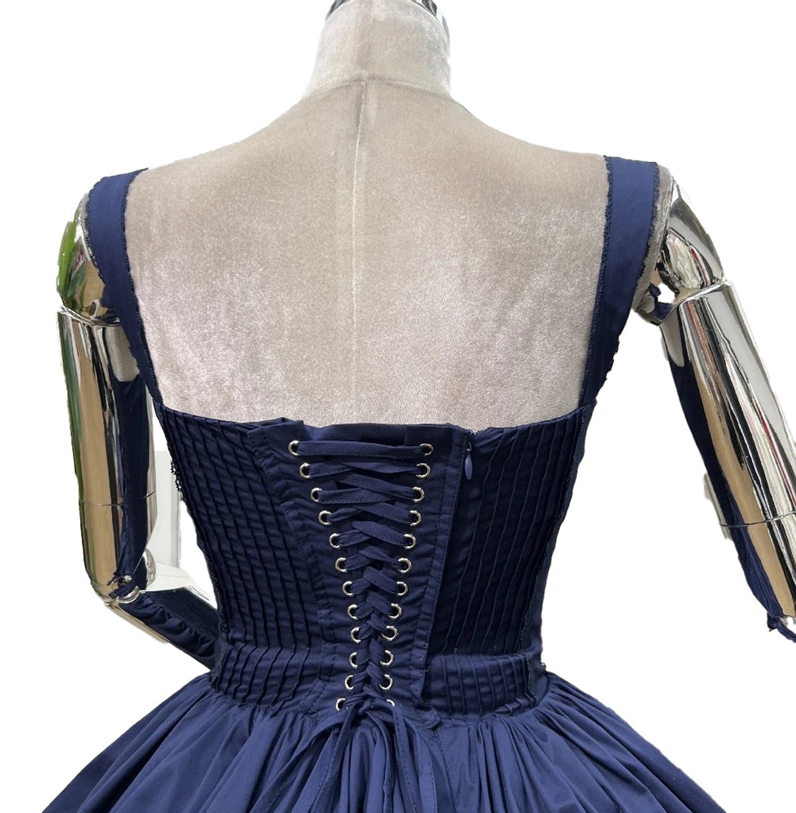 Back view of an elegant lace mini dress for women featuring a corset design and pleated skirt