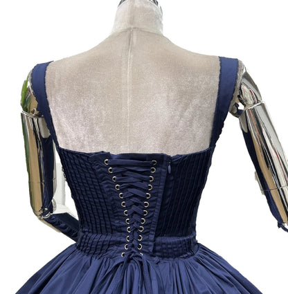 Back view of an elegant lace mini dress for women featuring a corset design and pleated skirt