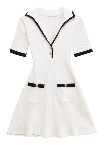 Elegant mini dress for women in white with navy accents and pockets, perfect for casual outings