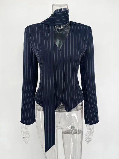 Elegant striped suit coat for women in dark navy with a unique tie detail and long sleeves