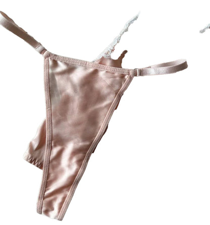 Soft pink chemise with lace trim and matching thong, featuring a sexy deep v neck satin dress design