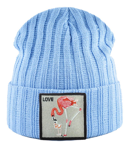Light blue embroidered beanie for women featuring a colorful flamingo design