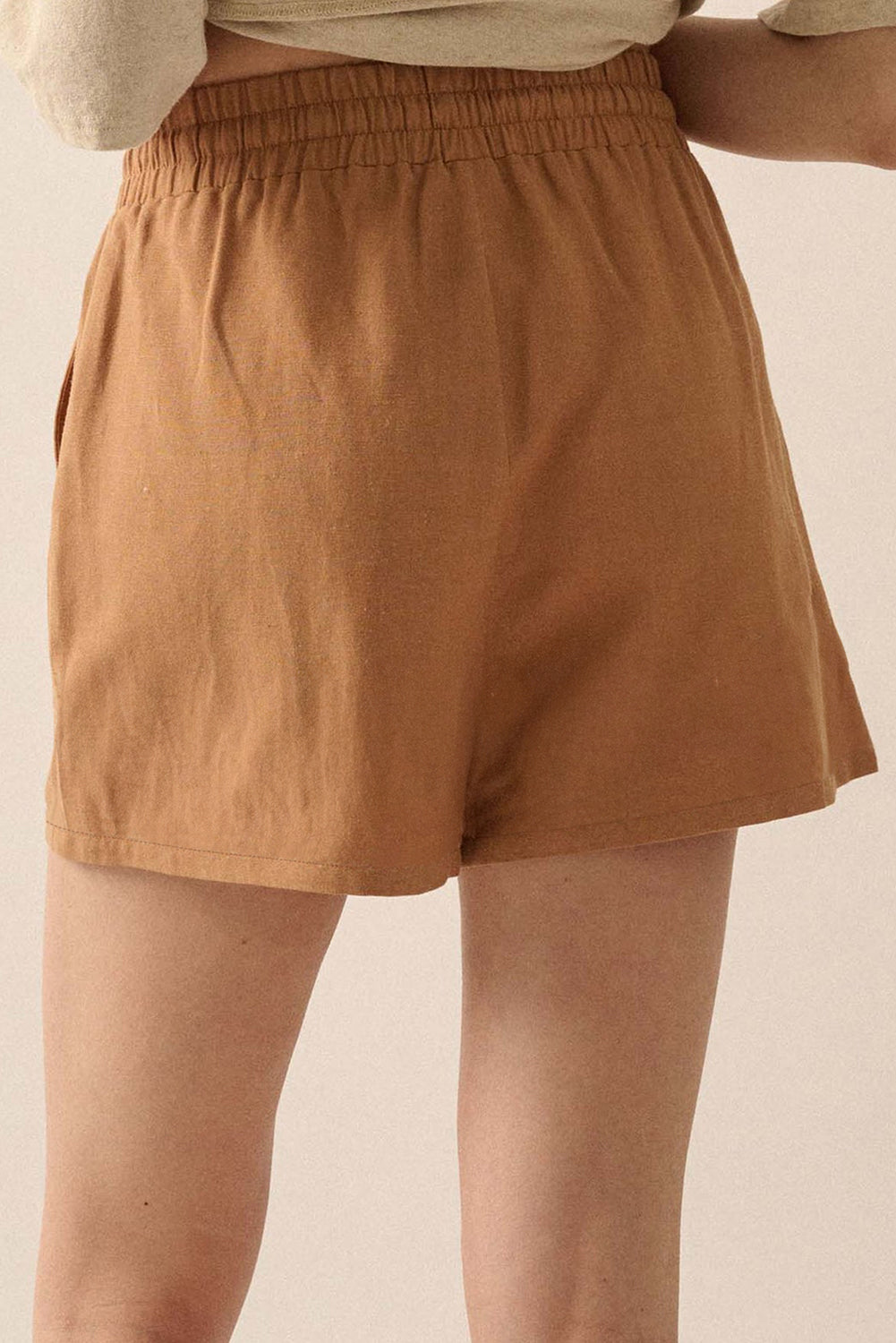 Brown embroidered shorts with a comfortable elastic waistband for a relaxed fit