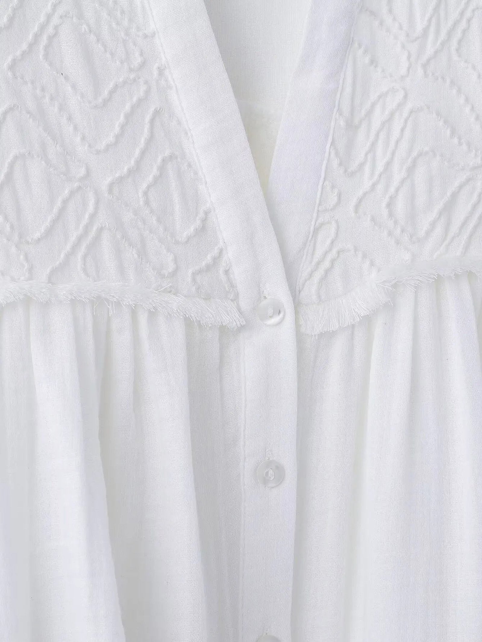 Embroidered white blouse for women with delicate detailing and button closure from LuckeLadybug LLC