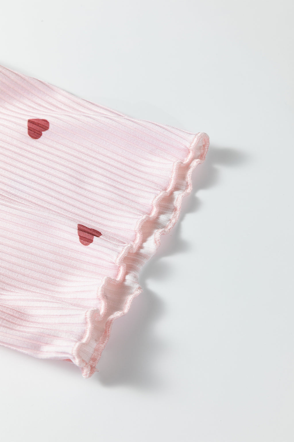 Pink lounge room set shorts with heart pattern and stylish ruffles for comfortable lounging