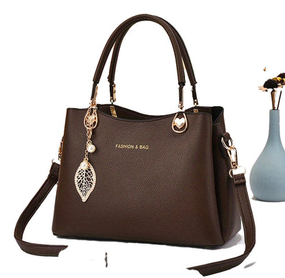 Elegant white handbag for women with stylish gold accents and a removable strap