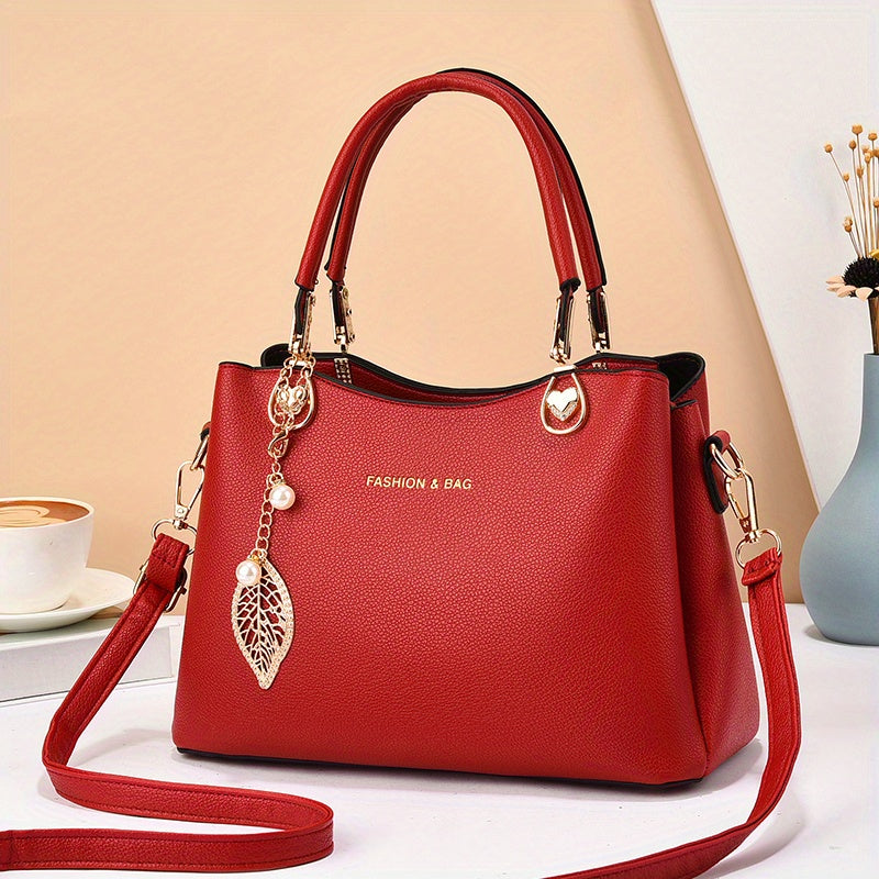 Stylish red satchel bag with detachable strap, perfect for pairing with an elegant white handbag for women