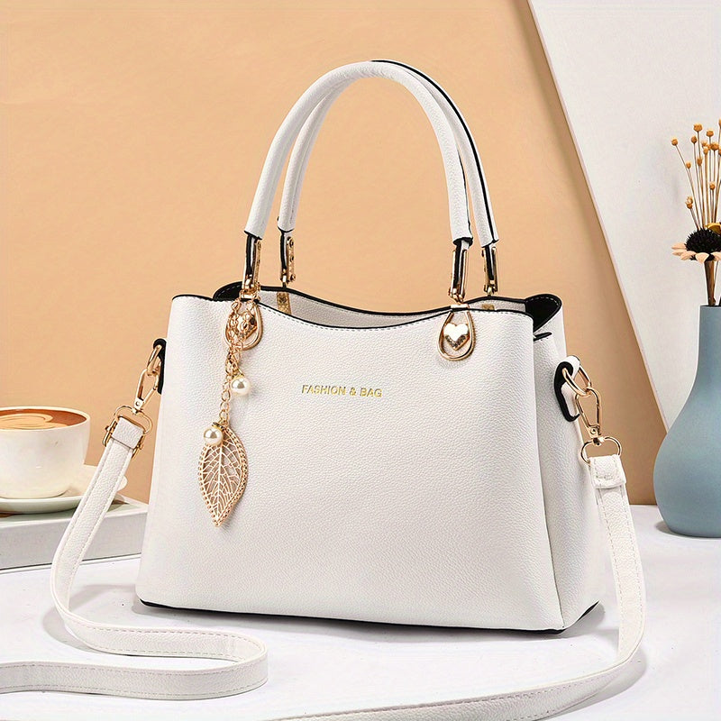 Elegant white handbag for women with stylish charm and dual handles, perfect for chic outings