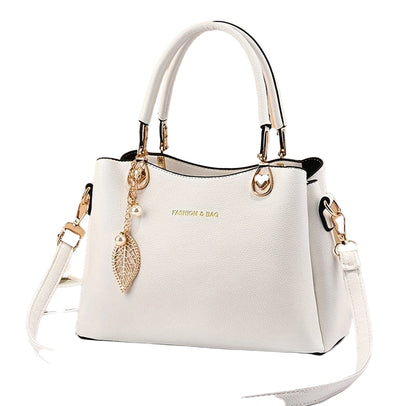 Elegant white handbag for women by LuckeLadybug LLC with stylish gold accents and detachable strap