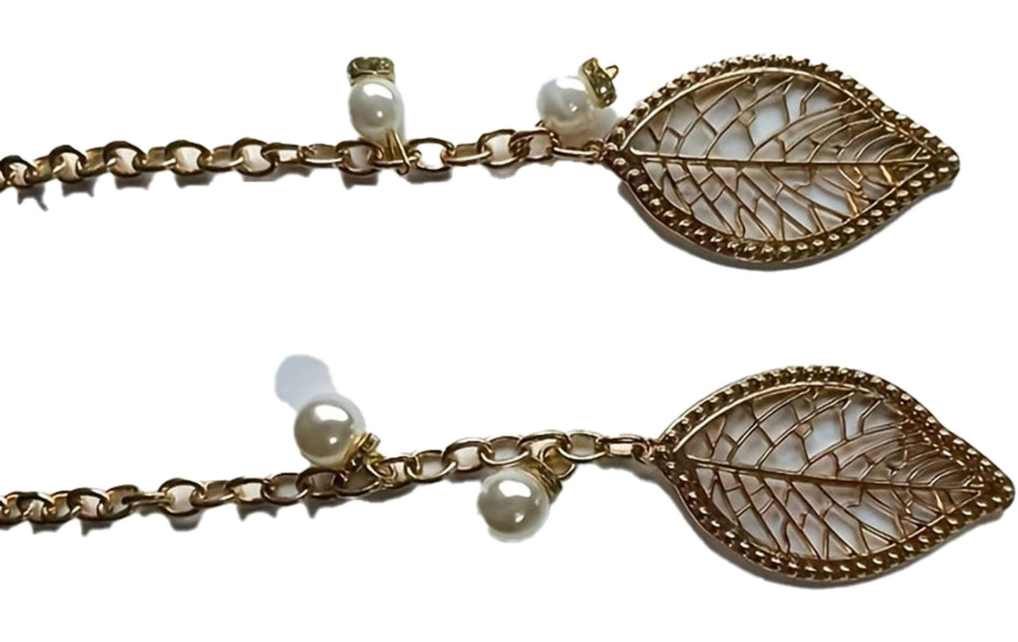 Elegant white handbag for women with delicate leaf-shaped gold accents and pearl details